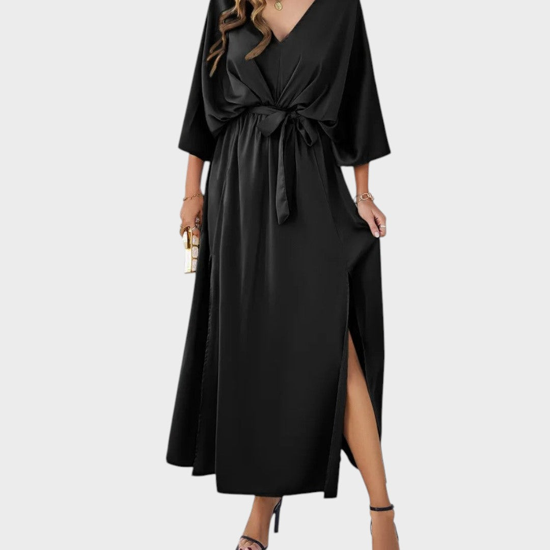 Cvita - Obleka z V-izrezom" can be rewritten as "Cvita - V-Neck Dress.