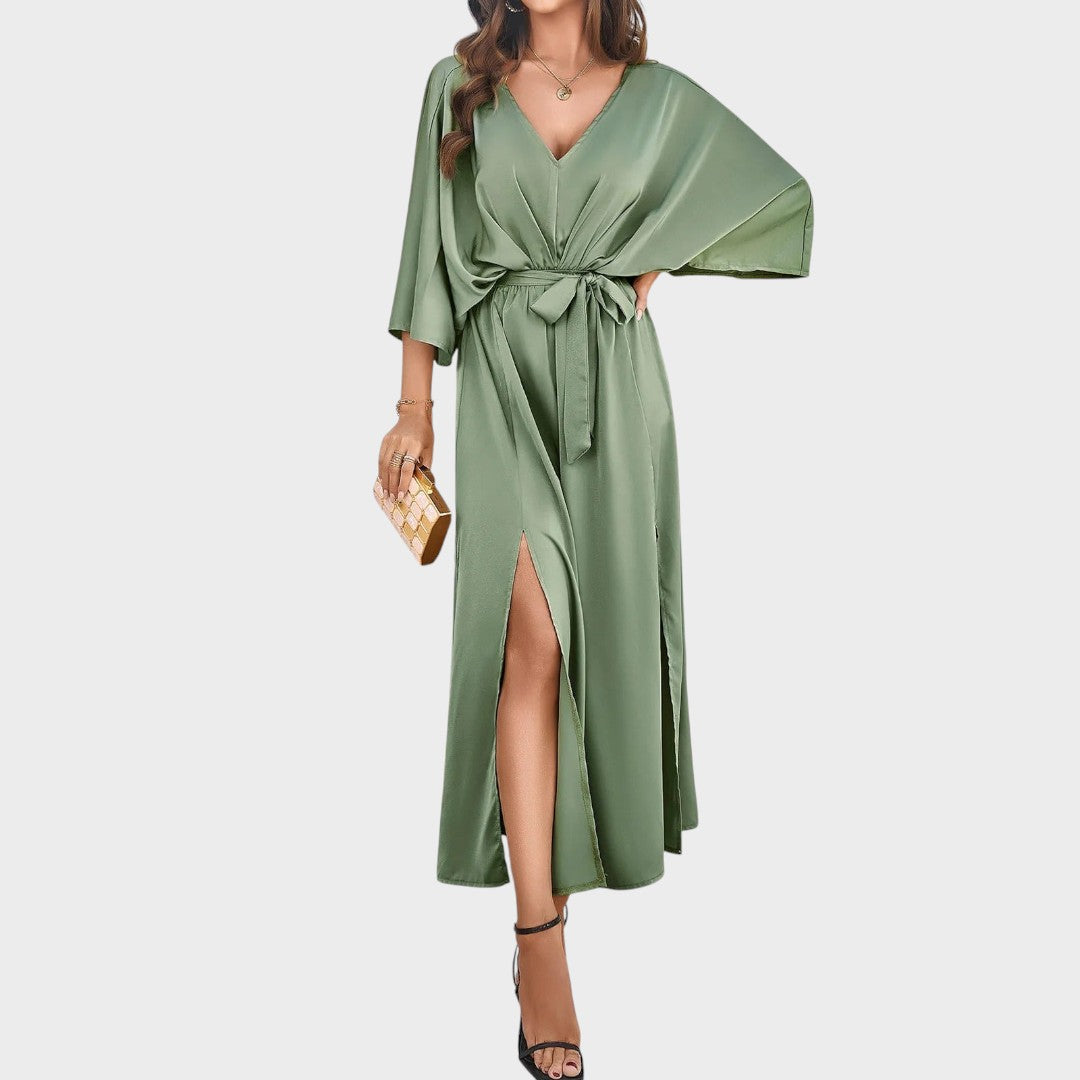 Cvita - Obleka z V-izrezom" can be rewritten as "Cvita - V-Neck Dress.